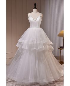 Get 10% off now! Buy elegant ruffled ballgown long white wedding dress with beaded pearls at cheap price online. Free stable shipping and pro custom service since 2009. Long White Wedding Dress, Tulle Long Prom Dress, Pearl Wedding Dress, Dress With Train, A Line Evening Dress, White Wedding Dress, فستان سهرة, White Tulle, Dress A Line