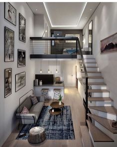 a living room filled with lots of furniture and pictures on the wall next to stairs