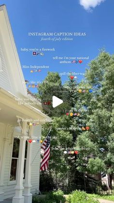 an american flag hanging from the side of a white house with words written below it