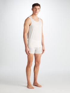 Featuring soft, narrow binding on the scooped neck and armholes that are shaped for comfort and ease of movement. An effortless underwear basic or everyday layering option. Crafted from an ultra-soft blend of 92% Pima cotton 8% elastane, that looks as good as it feels. This vest will provide a comfortable foundation for layering season after season. The model is 6'1" / 185cm tall. He wears a size Medium. Daywear Stretch Scoop Neck Tank Top, Scoop Neck Stretch Tank Top For Daywear, Everyday Tops With Light Support And Scoop Neck, Everyday Scoop Neck Top With Light Support, Casual Scoop Neck Tank Top With Light Support, Derek Rose, Jack White, Cotton Vest, Gift Wrapping Services