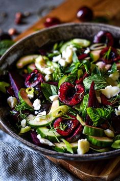 a salad with beets, avocado and feta cheese in a bowl