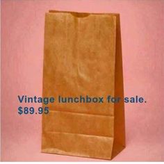 a brown paper bag with the words vintage lunchbox for sale