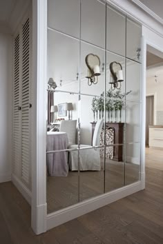 a mirrored wall in the middle of a room