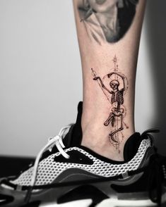 a person with a tattoo on their foot