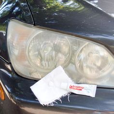 a close up of a car headlight with a cloth on it