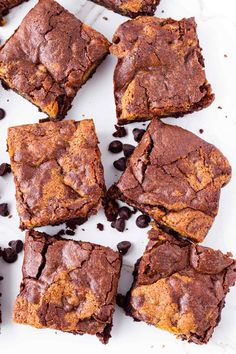 chocolate chip brownies cut into squares on a white surface