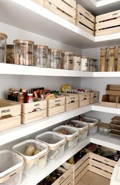 an organized pantry with bins and baskets