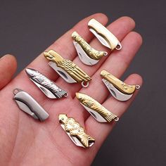 a hand holding several different types of metal objects