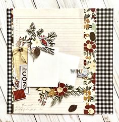 an open scrapbook with paper flowers and pine cones on the cover, along with other papers