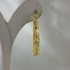 Elevate your style with these enchanting filigree earrings, designed to evoke admiration and elevate your festive looks, making them an ideal Christmas gift that exudes grace, elegance, and enduring beauty. 18K Gold Plated Floral Filigree Design Length: 40mm I 1.6 inch Width: 6mm I 0.2 inch , 13 grams Elegant Hoop Earrings With Intricate Design For Wedding, Elegant Small Hoop Earrings With Intricate Design, Elegant Intricate Hoop Earrings For Wedding, Wedding Hoop Earrings With Intricate Design, Filigree Round Hoop Earrings For Wedding, Elegant Small Hoop Filigree Earrings, Gold Hoop Earrings With Elegant Design, Intricate Design Hoop Earrings For Wedding, Elegant Gold Round Hoop Earrings