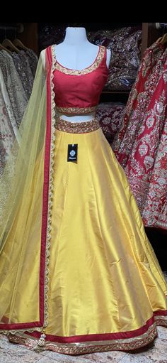 Tuscany yellow plain lehenga with broad gotta patti border teamed with contrasting red blouse and net dupatta. Fabric: Raw Silk This outfit can be customized in multiple colors and specific to client measurements. 90 days of production time is required and are for bulk orders only! Orders are processed in store only! Final fittings/alterations not included. Minimum Order Quantity- 4 pieces Yellow Raw Silk Choli With Gota Work, Yellow Raw Silk Lehenga With Dori Work, Yellow Raw Silk Set With Sheer Dupatta, Yellow Raw Silk Lehenga For Party, Yellow Art Silk Lehenga With Dori Work, Yellow Raw Silk Choli For Diwali, Party Yellow Raw Silk Lehenga, Navratri Yellow Raw Silk Lehenga, Festive Yellow Raw Silk Choli