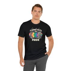 Broadcast your pride loud and clear with our unique "Tuned Into Pride" t-shirt. Taking inspiration from the classic allure of retro TVs and blending it seamlessly with the vivacious rainbow hues representing LGBTQ pride, this tee captures the essence of both nostalgia and contemporary acceptance. Its high-quality fabric ensures comfort as you wear your pride, and the distinctive design guarantees second glances. Whether it's Pride Month, a special celebration, or simply a day to radiate love, this tee is your perfect choice. Pride Tees, Tv Design, Pride Tshirts, Retro Tv, Lgbtq Pride, Vintage Tv, Bold Fashion, Black Tee, Length Sleeve