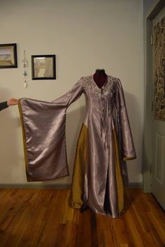 This is a Handmade Cosplay based off of Cersei Lannisters dresses. You can get the Red and beige design which is the most Icon, purple and Beige or Blue and dusty Gold. You can chooses to have no embroidery work or Embroidery that's close to the show design. the belt is NOT INCLUDED, this listing is for the dress only. wig also not included! Sizing is US women's sizing, It is suggested to pick your usual dress size or if concerned one size up. If you have questions about the specific measurement Fantasy Style Purple Dress For Costume Party, Purple Fantasy Dress For Costume Party, Purple Fantasy Costume Party Dress, Fitted Dresses For Cosplay And Fantasy Events, Fantasy Costume Dresses For Cosplay Events, Purple Fantasy Dresses For Fantasy Events, Purple Costume Dress For Cosplay Events, Fairytale Costume For Cosplay Events, Purple Long Sleeve Costume For Costume Party