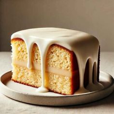 a cake with white icing on a plate