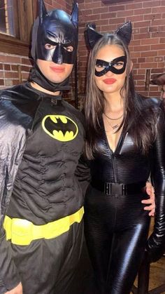 two people dressed up as batman and catwoman