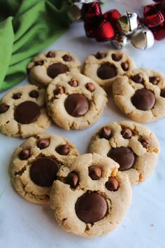 chocolate chip cookies are arranged on a table