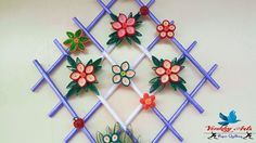 a decorative wall hanging with flowers and butterflies on it's sides, in the shape of a trellis