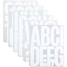 four white stickers with the words abc and dfg written in black on them