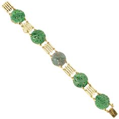 1940's Art Deco Jade bracelet in slightly green gold with certified untreated round Jadeite Jade. 5 green 18.7mm x 2.0mm round carved Jadeite Jade, natural, no enhancements and no treatments, GIA certificate #2205069196 Length: 7 inches 14k green gold 21.6 grams Tested and stamped: 14k Hallmark: WL Carved Green Round Jewelry, Green Carved Round Jewelry, Luxury Green Bracelets, Vintage Round Jade Bracelets, Vintage Jade Round Bracelets, Vintage Jade Bracelets, Gold Armband, Jade Bracelet, Jade Carving