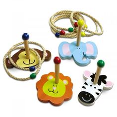 four wooden toys with animals on them