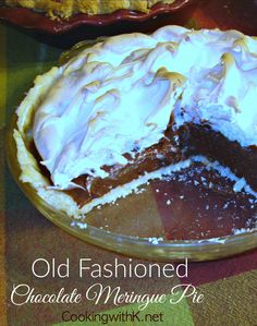 an old fashioned chocolate meringue pie on a table