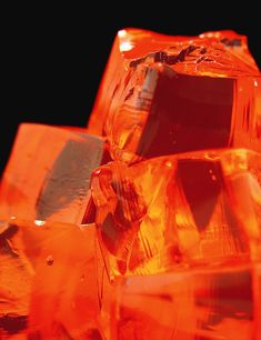 an orange glass object sitting on top of a table