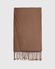 Our Cashmere Silk Scarf combines two of our favorite materials. This super soft, airy scarf has long fringe borders for a classic yet elegant look you'll love wearing around. Solid Color Fringe Scarf For Fall, Classic Fall Pashmina Shawl, Elegant Fringed Scarves For Fall, Classic Brown Shawl Scarves, Elegant Fringe Shawl Scarf, Elegant Fringed Shawl Scarf, Elegant Winter Shawl With Tassels, Elegant Tasseled Shawl For Winter, Classic Solid Color Pashmina Scarves