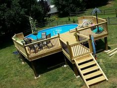 an above ground swimming pool with stairs leading to the deck and steps up to it