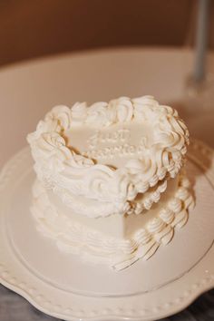 a heart shaped cake sitting on top of a white plate