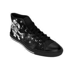 "You'll love these Womens Epic Black and White Astronaut Galaxy High Tops! With a black and white high contrast astronaut galaxy design with stars and space dust they're sure to get noticed, look cute and get compliments. A perfect christmas or birthday gift idea for any fan of the stars, space travel, science fiction, astronauts and all things astronomy or intergalactic. These durable classic canvas sneakers are super comfy to walk in with extra cushion and support and feature an advanced fade Punk Black High-top Sneakers For Streetwear, High-top Star Print Sneakers For Streetwear, Black Punk High-top Sneakers, Black High-top Sneakers With Graphic Print For Streetwear, Black Graphic Print High-top Sneakers For Streetwear, Punk Style Black High-top Sneakers, Black Mid-top Sneakers With Graphic Print, Black Graphic Print Mid-top Sneakers, Black Graphic Print High-top Sneakers