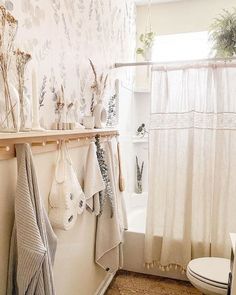 a bathroom with towels hanging on the wall