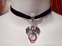 "Narrow black velvet band with silver colored dragon pendant. choker adjusts between 12 to 14\", so best for necks under 13.5\". that's pretty slender. band is 1cm wide, pendant .75\" tall, not including bail. handmade from all new materials." Adjustable Silver Halloween Choker, Adjustable Silver Choker For Halloween, Adjustable Black Fantasy Choker, Silver Fantasy Choker Adjustable, Fantasy Style Adjustable Choker Jewelry, Adjustable Fantasy Style Choker Jewelry, Adjustable Fantasy Style Choker, Adjustable Silver Fantasy Choker, Black Fantasy Choker As A Gift