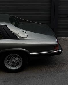 a car parked in front of a garage door