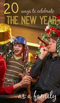 two boys wearing party hats and holding flutes