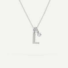 A personalized letter necklace design featuring an initial L pendant. This beautiful women's letter necklace is approx. 1cm tall and comes in solid 14k white or yellow gold with an optional 0.05 carat (3mm) diamond and an adjustable 16 inch - 18 inch chain. Everyday Diamond Initial Necklace, Classic White Gold Charm Necklace With Initials, Classic White Gold Monogram Initial Necklace, Diamond Initial Pendant Charm Necklace, Diamond Initial Pendant Charm Necklaces, Minimalist Monogram Initial Necklace In White Gold, Minimalist White Gold Monogram Initial Necklace, White Gold Initial Pendant Name Necklace With Initials, White Gold Initial Pendant Name Necklace