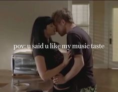 a man and woman kissing in front of a toaster oven with the words pov u said u like my music taste