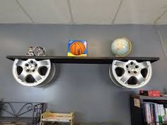 there are two wheels on the shelf above the bookshelf