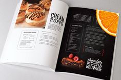 an open magazine with oranges and pastries on it