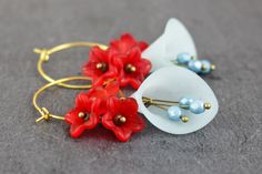 Beautiful earrings with cherry blossoms in light blue and red. Total length about 6cm Length of the pendant approx. 3.5 cm brass, acrylic, glass Whimsical Red Flower Jewelry, Blue Flower-shaped Hoop Earrings, Blue Flower Hoop Earrings Gift, Blue Flower Hoop Earrings As Gift, Blue Flower Shaped Hoop Earrings, Vintage Blue Hoop Earrings For Gift, Blue Vintage Hoop Earrings As Gift, Blue Vintage Hoop Earrings For Gifts, Blue Vintage Hoop Earrings For Gift