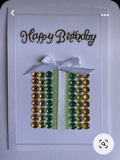 a happy birthday card with beads on it