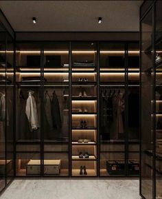 an empty walk in closet with lots of clothes and shoes on the shelves next to it