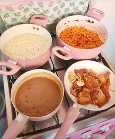 there are many different types of food on the stove top, including noodles and meat