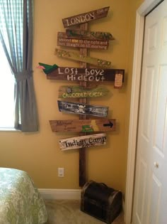 a bedroom decorated with wooden signs on the wall