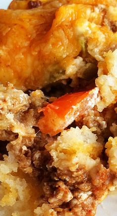 a close up of food on a plate with sauce and bread crumbs in it