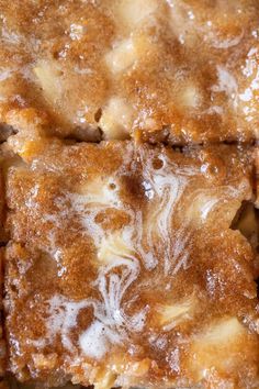 some kind of food that is sitting on a table with white icing and brown sugar