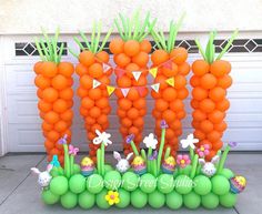 an inflatable balloon garden with carrots and bunnies