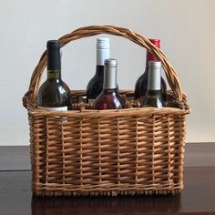 a wicker basket filled with bottles of wine