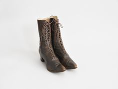 "Antique boots c. 1900-1910. Umber supple brown leather. Pointed toes with petite punched out detailing. Metal grommets for laces. Two inch wooden heels with rubber bottoms. Lined in canvas. A lovely example of early 20th century walking shoes. Condition | Overall age related wear and incomplete/ brittle laces. Parts of the soles are lifting at edges. refer to photos & request further photos if needed. Measurements ✂--- Best fit | US 6 1/2\" ** please refer to measurements Outer length | 9.7 Antique Leather Sole Boots With Round Toe, Vintage Brown Boots With Laces, Vintage Lace-up Boots With Goodyear Welted Construction, Vintage Brown Lace-up Boots, Vintage Brown Lace-up Heeled Boots, Vintage Lace-up Boots With Reinforced Heel, Vintage Brown Lace-up Closed Toe Boots, Vintage Lace-up Boots With Goodyear Welt Construction, Victorian Lace-up Boots With Leather Sole