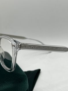 The Gucci GG0184O 012 Clear Square Frames fuse style and unisex appeal. The trendy clear frames are square-shaped and finished with sleek silver hardware. These glasses offer the perfect blend of fashion and functionality. Measures 50-21-145. Arrives in Gucci jewel toned velvet case, cleaning cloth, satin pouch and authenticity cards. 100% authentic. Made in Italy. Luxury Clear Rectangular Sunglasses, Gucci Clear Glass Sunglasses, Gucci Clear Square Frame Sunglasses, Designer Clear Sunglasses For Formal Occasions, Luxury Clear Square Frame Sunglasses, Gucci Designer Clear Sunglasses, Designer Gucci Clear Sunglasses, Luxury Clear Gucci Sunglasses, Designer Clear Glass Sunglasses