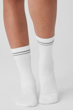 Step into your new favorite socks—they’re stretchy and sweat-wicking (for performance) and finished with a reflective Alo logo (for subtle flash in low light). Don’t miss the functional details, like ribbing at the ankles, ribbing at the midfoot and slight padding at the heels and toes for a comfortable fit. Sporty Sweat-resistant Socks For Sports, Sporty Moisture-wicking Socks For Training, Sporty Moisture-wicking Socks For Gym, Comfortable Sweat-resistant White Socks, Comfortable Sweat Resistant White Socks, Sporty Moisture-wicking Gym Socks, Comfortable White Sweat Resistant Socks, Sweat Resistant Athleisure Socks For Gym, Sweat Resistant Gym Socks Athleisure